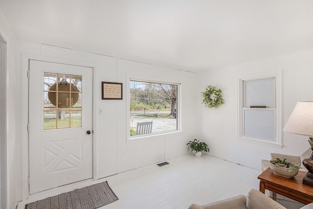 doorway to outside featuring visible vents