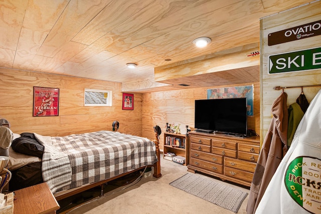 carpeted bedroom with wood ceiling and wood walls