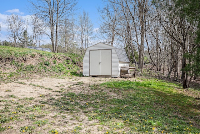 view of yard with an outbuilding and a storage shed