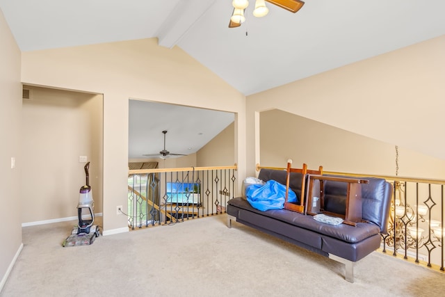 living area featuring vaulted ceiling with beams, ceiling fan, and carpet