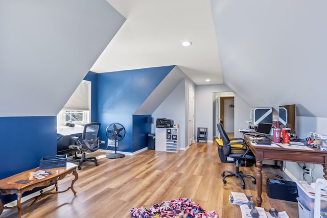 office space featuring recessed lighting, baseboards, wood finished floors, and lofted ceiling
