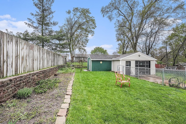 view of yard featuring an outbuilding and a fenced backyard