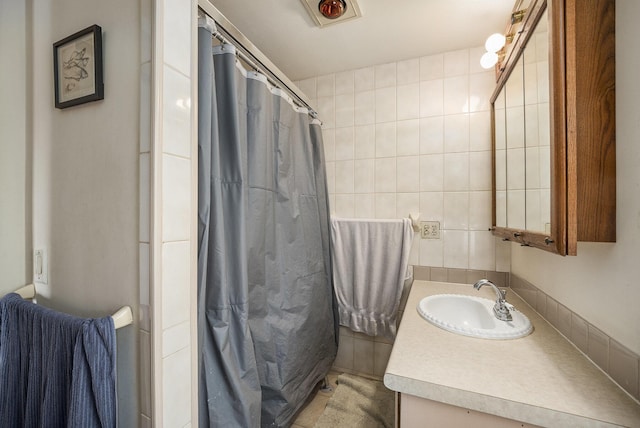 full bath with vanity and curtained shower