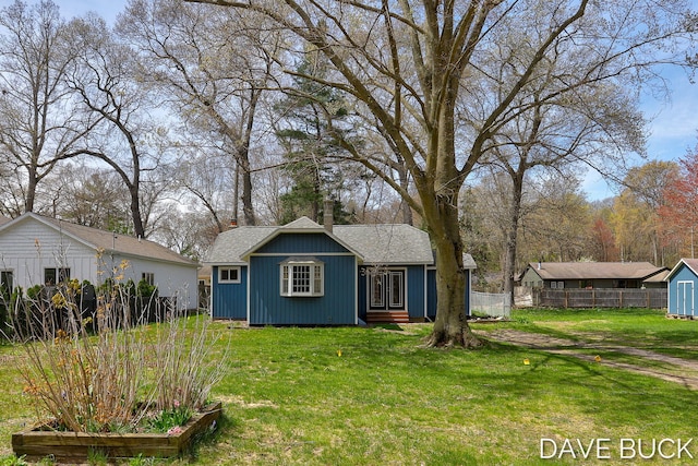 15242 152nd Ave, Spring Lake, MI 49456 - exterior space with a chimney, fence, an outbuilding, and a front yard