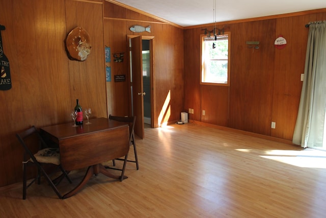 17980 1ST Callejon, Barryton, MI 49305 - dining area featuring light wood-style floors, baseboards, lofted ceiling, and wooden walls
