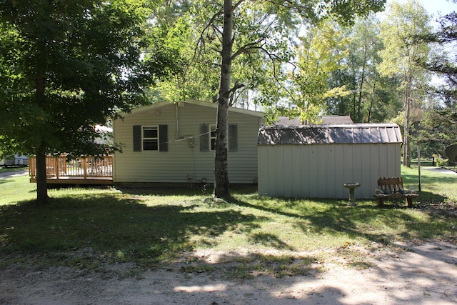 17980 1ST Callejon, Barryton, MI 49305 - exterior space with a lawn, a deck, and an outbuilding
