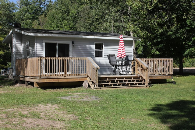 17980 1ST Callejon, Barryton, MI 49305 - rear view of property with a yard and a deck
