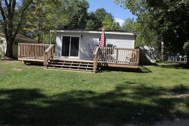 17980 1ST Callejon, Barryton, MI 49305 - back of house with a lawn and a deck