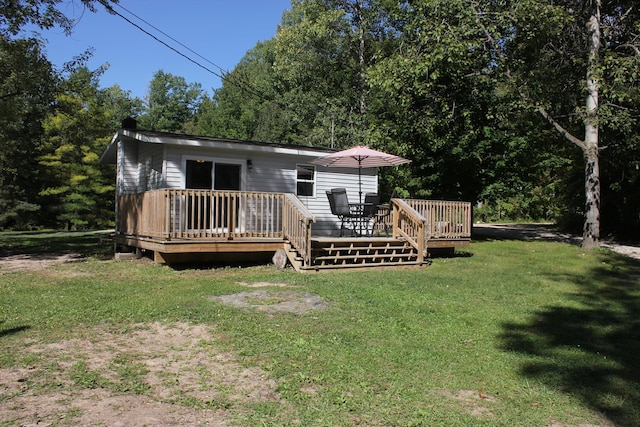 17980 1ST Callejon, Barryton, MI 49305 - back of house featuring a lawn and a deck