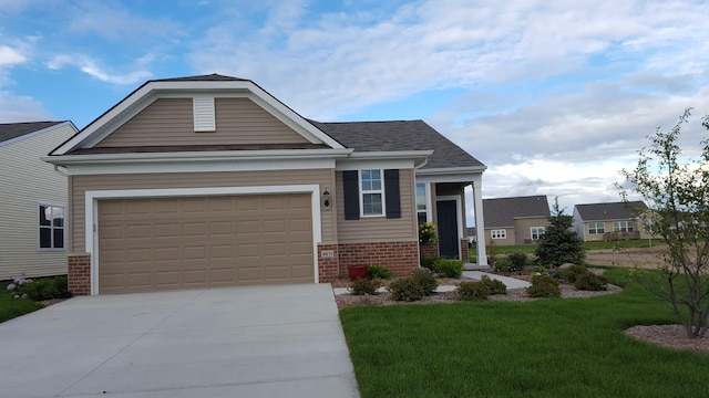 view of front of property featuring brick siding, an attached garage, driveway, and a front lawn