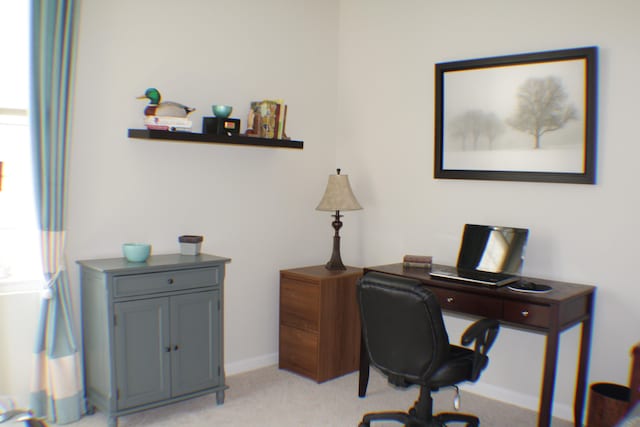 office featuring baseboards and light colored carpet