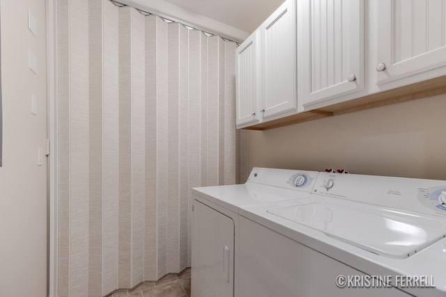 laundry area with washer and clothes dryer and cabinet space