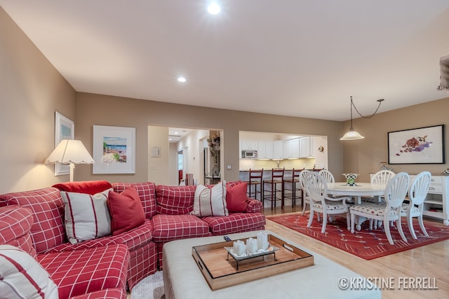 living area featuring recessed lighting and light wood-type flooring