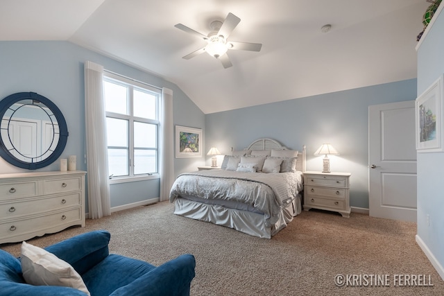 bedroom with carpet floors, baseboards, and lofted ceiling