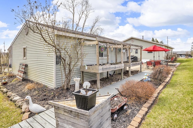 220 Nottingham Dr, Brooklyn, MI 49230 - rear view of house with a lawn and a patio area