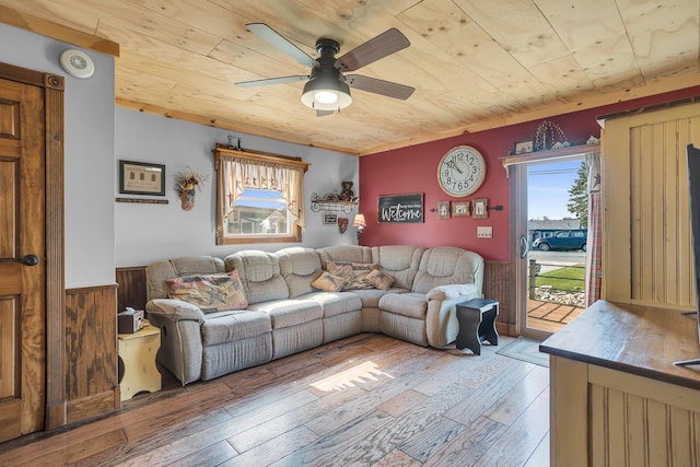 220 Nottingham Dr, Brooklyn, MI 49230 - living area with a ceiling fan, light wood finished floors, a wainscoted wall, and wood ceiling