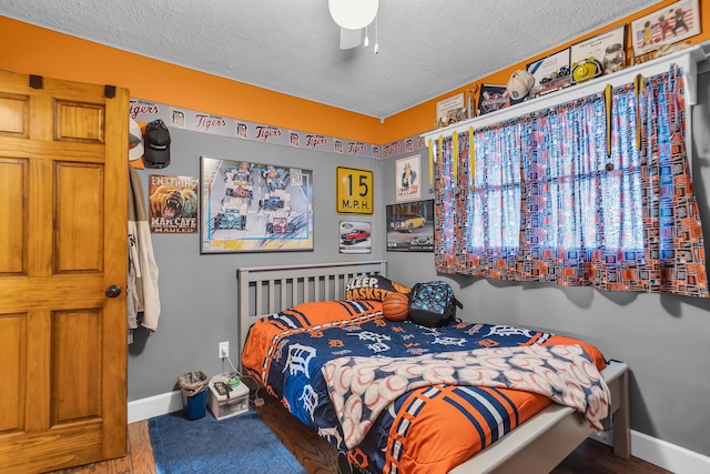 220 Nottingham Dr, Brooklyn, MI 49230 - bedroom featuring a textured ceiling, baseboards, and ceiling fan