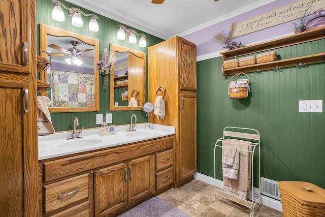 220 Nottingham Dr, Brooklyn, MI 49230 - full bath featuring crown molding, a sink, ceiling fan, and double vanity