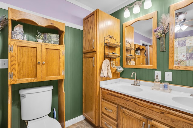 220 Nottingham Dr, Brooklyn, MI 49230 - bathroom featuring a sink, ornamental molding, toilet, and double vanity
