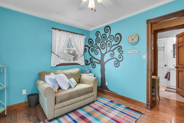 220 Nottingham Dr, Brooklyn, MI 49230 - living area with baseboards, a ceiling fan, and hardwood / wood-style floors