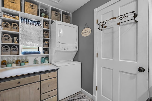 220 Nottingham Dr, Brooklyn, MI 49230 - laundry room featuring stacked washer / drying machine and laundry area
