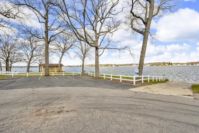 220 Nottingham Dr, Brooklyn, MI 49230 - exterior space featuring a water view and fence