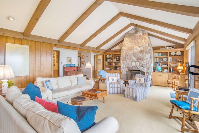 living room featuring vaulted ceiling with beams, carpet flooring, wooden walls, and a fireplace