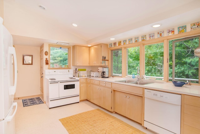 kitchen featuring light brown cabinetry, a sink, white appliances, light countertops, and recessed lighting