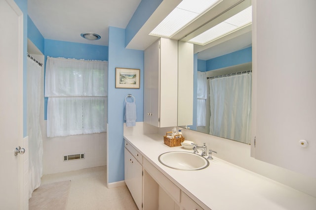 full bath with vanity and visible vents
