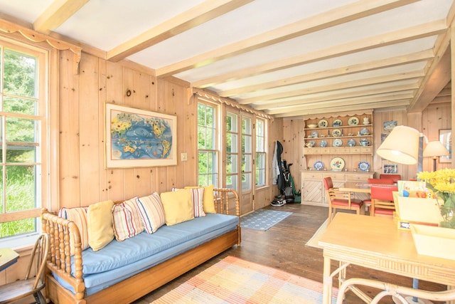 sunroom featuring beamed ceiling