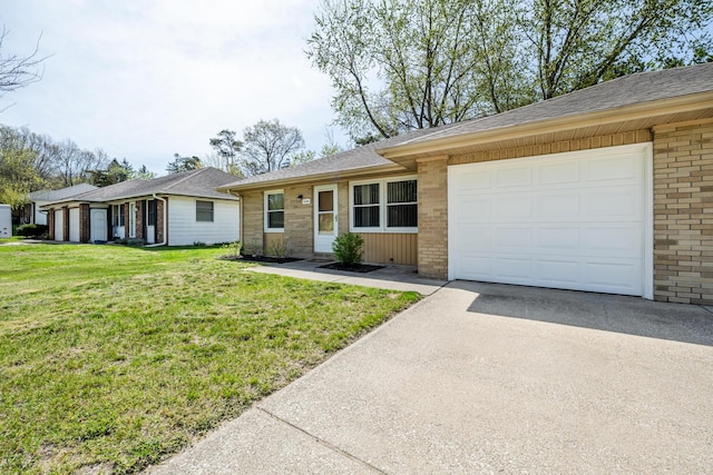 single story home with roof with shingles, a garage, brick siding, a front lawn, and concrete driveway