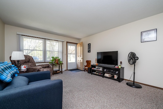 living area featuring carpet floors, baseboards, and a baseboard heating unit
