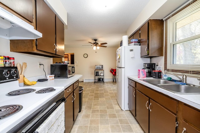kitchen with ceiling fan, a sink, white appliances, light countertops, and under cabinet range hood