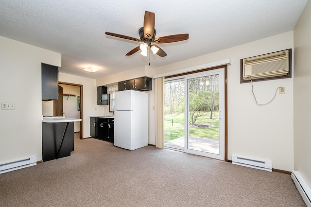 unfurnished living room with light colored carpet, a baseboard radiator, a ceiling fan, and baseboard heating