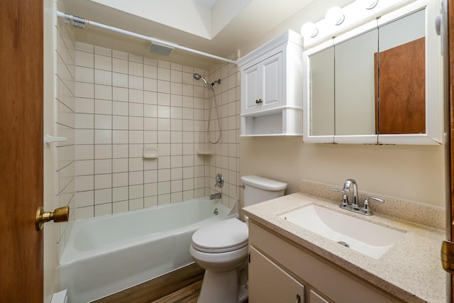 full bath featuring vanity, toilet, shower / tub combination, and wood finished floors