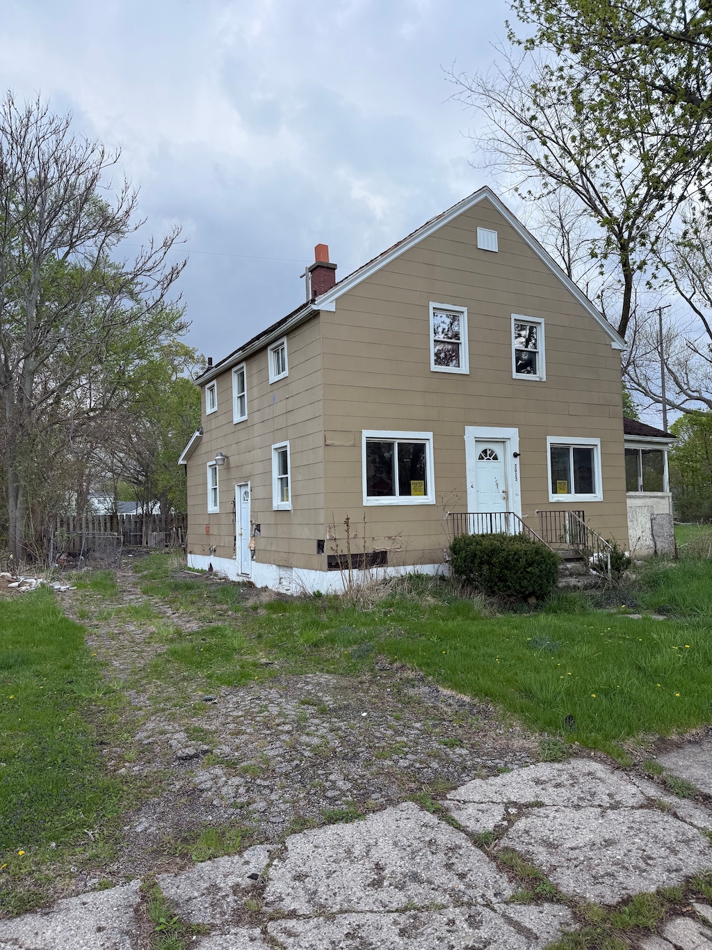 rear view of property with a chimney