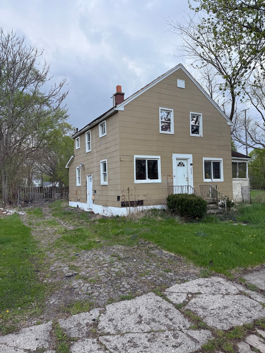 back of property featuring a chimney