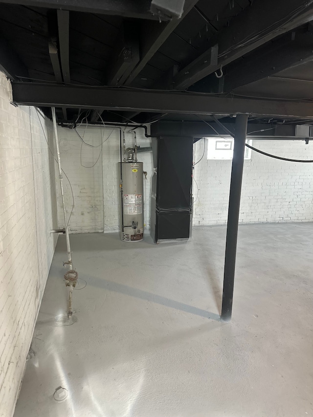 basement featuring heating unit and gas water heater