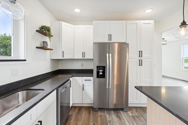 kitchen featuring open shelves, wood finished floors, white cabinets, and stainless steel appliances