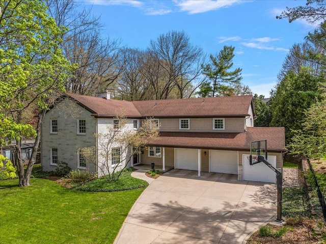 traditional-style home with a garage, a front yard, a chimney, a shingled roof, and concrete driveway