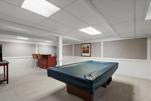 game room featuring wainscoting, a decorative wall, a bar, billiards, and carpet