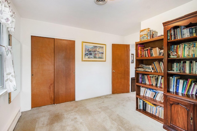 sitting room with visible vents, carpet flooring, and baseboard heating