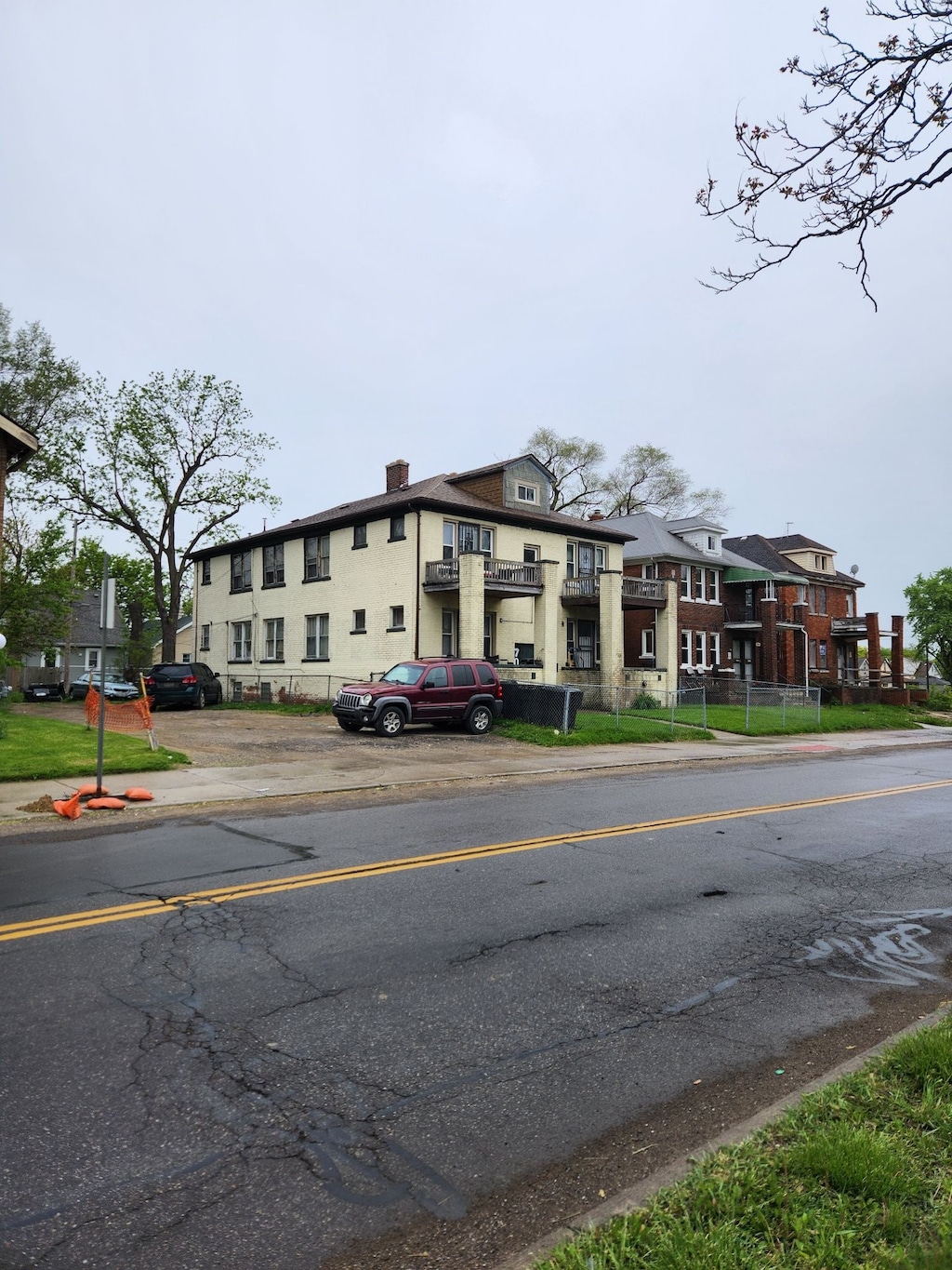 view of building exterior with uncovered parking