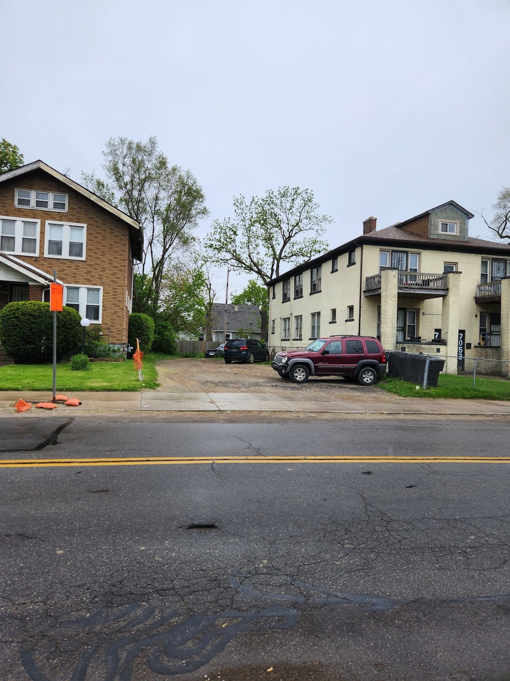 view of road with sidewalks and curbs