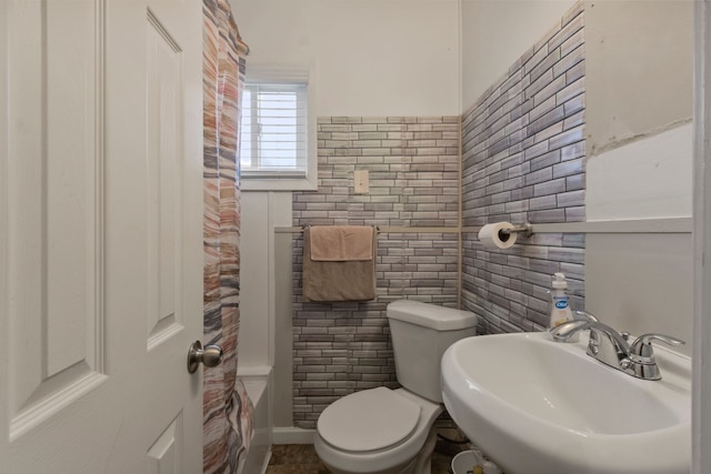 25884 Leach St, Roseville, MI 48066 - bathroom featuring toilet, tile walls, and a sink