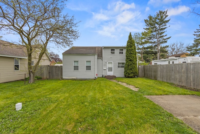 25884 Leach St, Roseville, MI 48066 - back of house with a yard, a fenced backyard, and entry steps