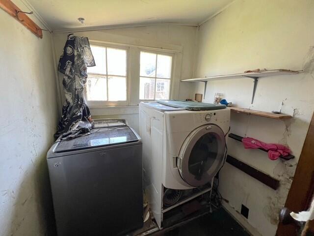 laundry room featuring laundry area and washing machine and clothes dryer
