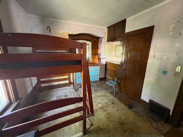 unfurnished bedroom with visible vents