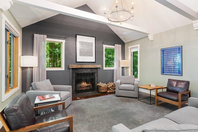 living room featuring a fireplace with flush hearth, plenty of natural light, a notable chandelier, and lofted ceiling
