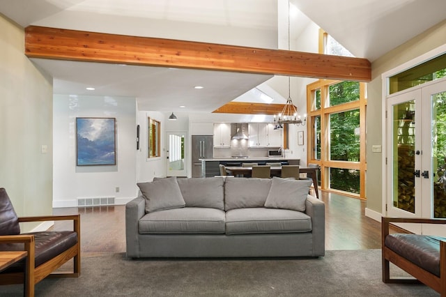 living area featuring a chandelier, recessed lighting, baseboards, vaulted ceiling with beams, and visible vents
